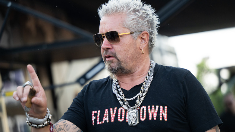 Guy Fieri pointing upward