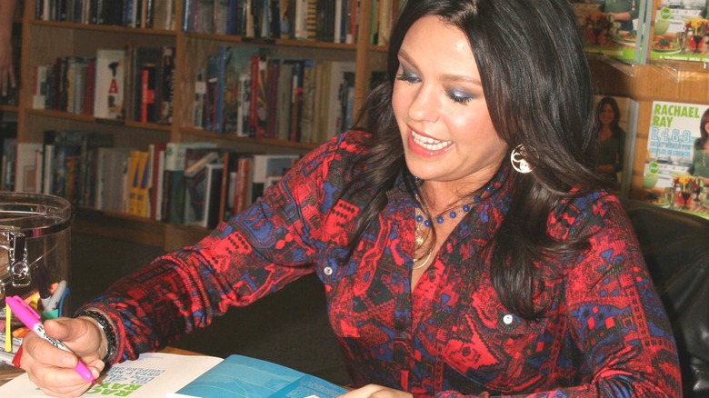 Rachael Ray signing a book