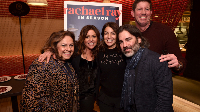 Rachael Ray posing with husband and friends