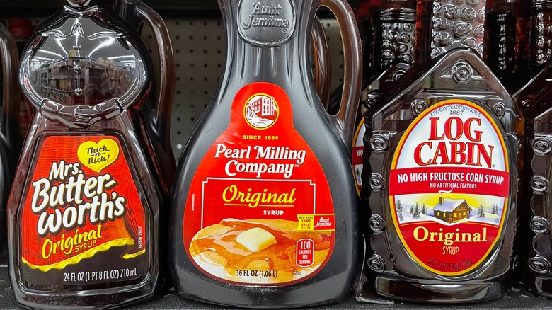 Three brands of pancake syrup in store