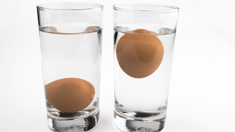 two glasses filled with brown eggs