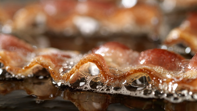 up close view of bacon being cooked