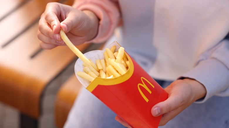 Person eating McDonald's fries