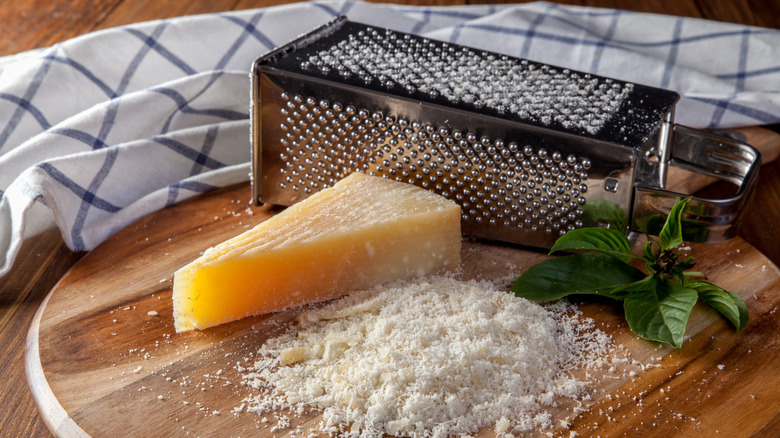 Box grater with parmesan cheese wedge