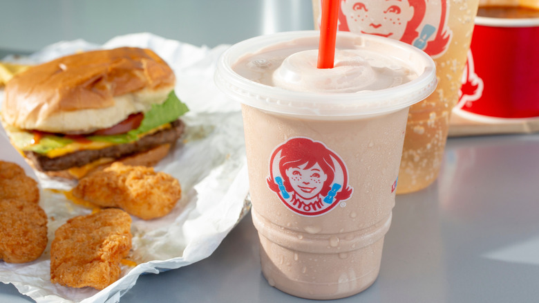 Wendy's Frosty beside a burger and chicken nuggets