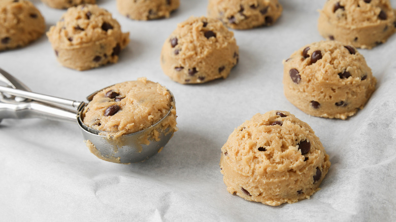 Scooped cookie dough on a baking sheet