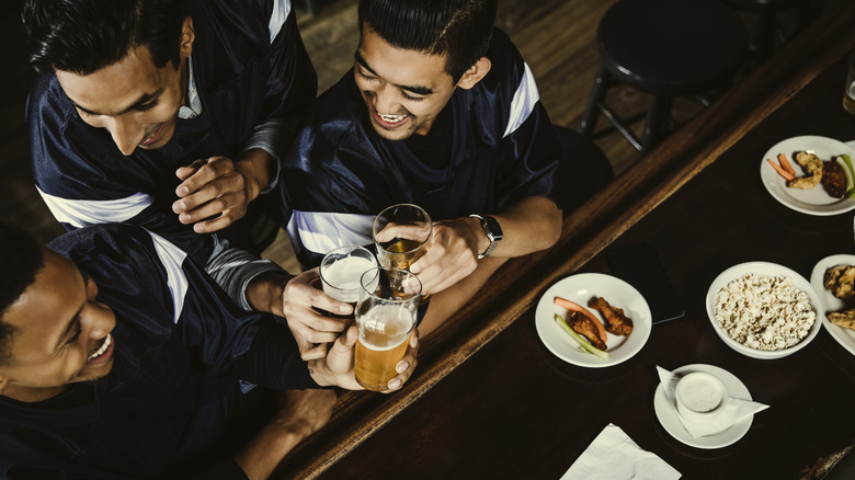 Patrons at bar with food