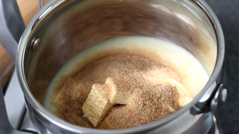 Brown sugar, butter, and cream in a pot