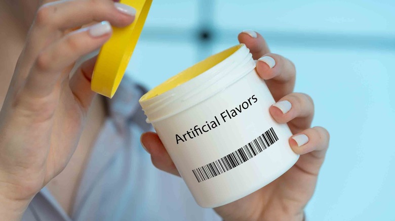 woman with jar of artificial flavors