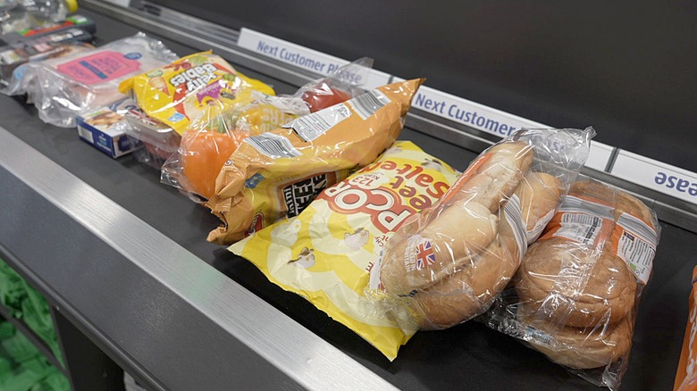 Grocery store items on conveyor belt