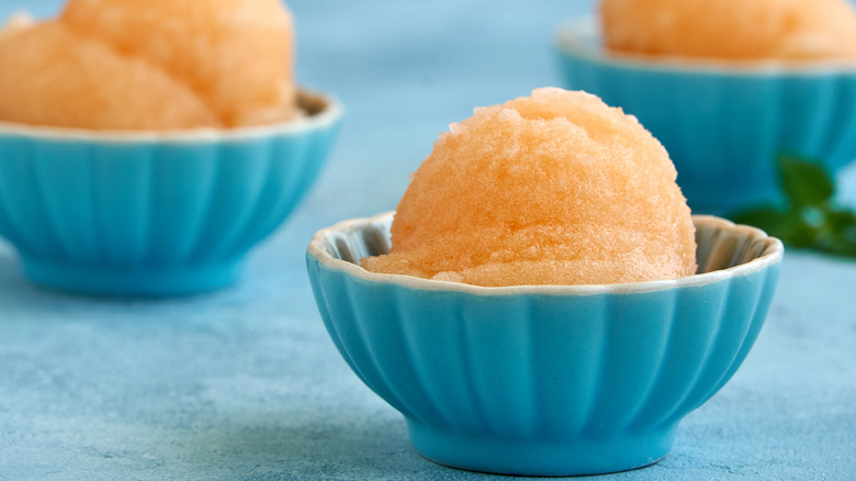 Homemade peach or melon sorbet in a bowl.