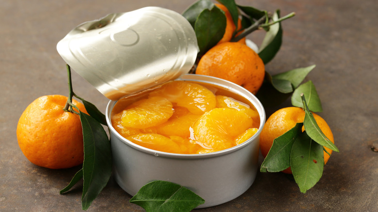 Canned Mandarin oranges in syrup besides fresh oranges.