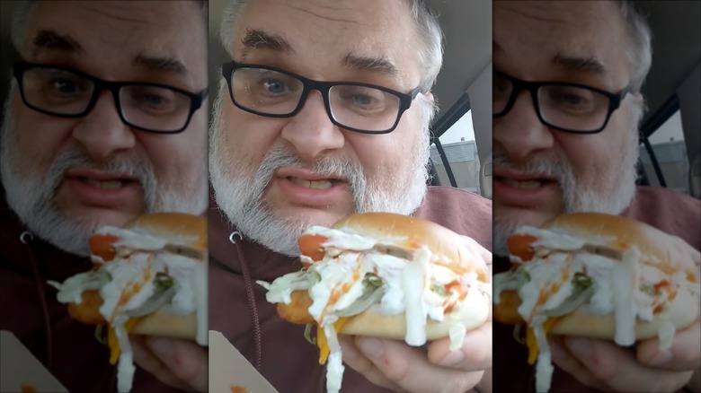 Man holding Filet-O-Fish BLT