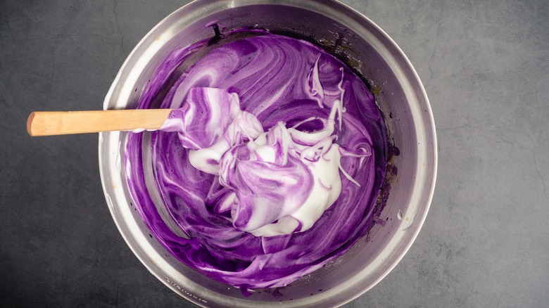 Ube being mixed into batter