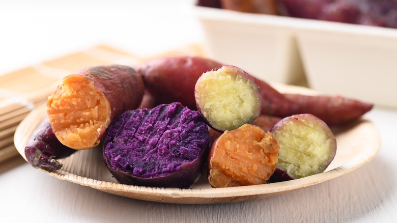 Cooked purple, orange, and white sweet potatoes