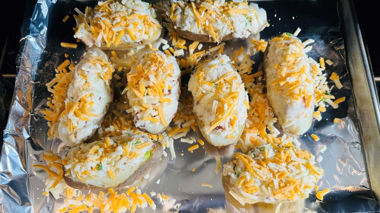 baked potatoes with shredded cheese