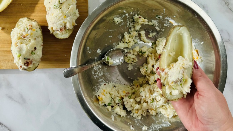 hand holding cooked potato