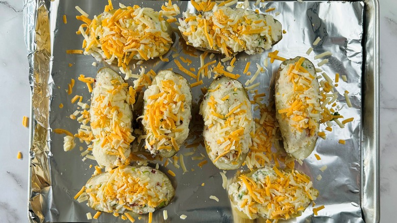 baked potatoes with shredded cheese