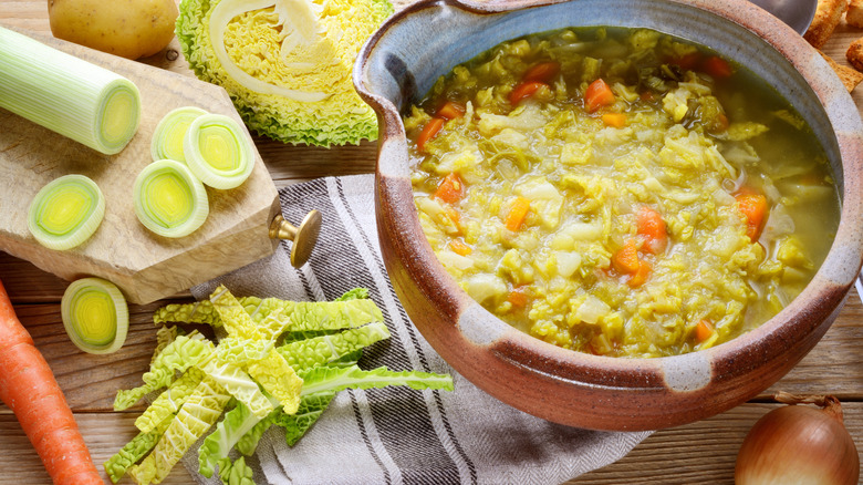 Cabbage and vegetables with soup in bowl