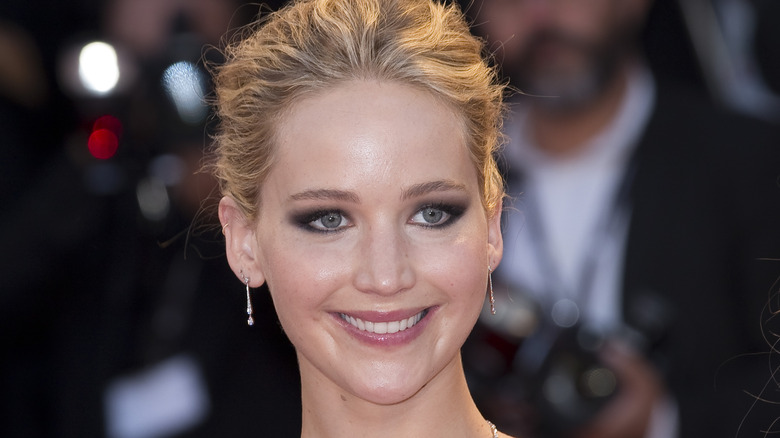 Jennifer Lawrence with hair up and smiling