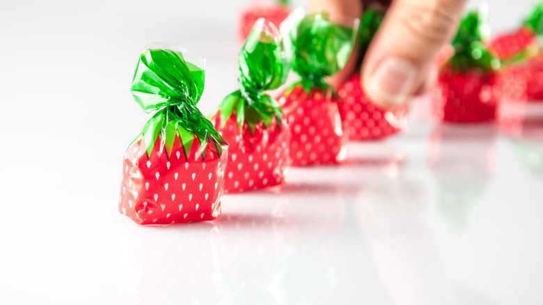 Line of wrapped strawberry hard candies