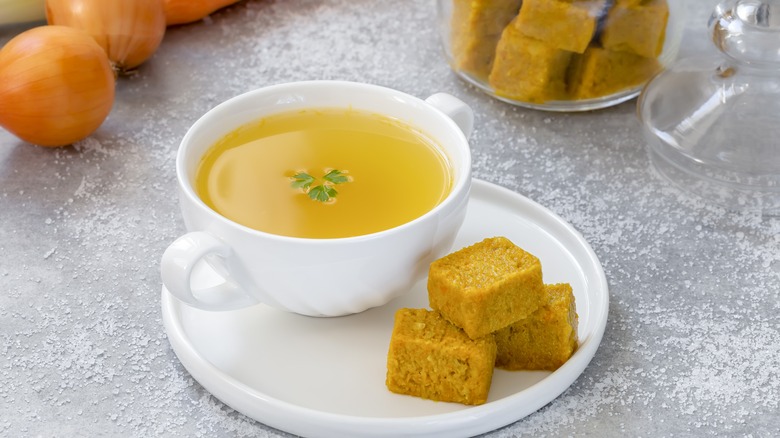 A dish of broth and bouillon cubes