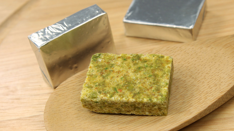 Unwrapped and foil-wrapped bouillon cubes