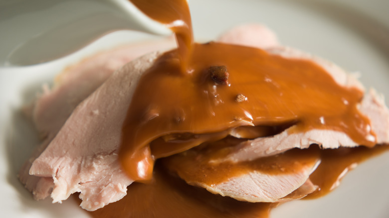 Gravy poured on turkey with giblets