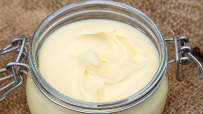 Homemade beef tallow in a glass jar.