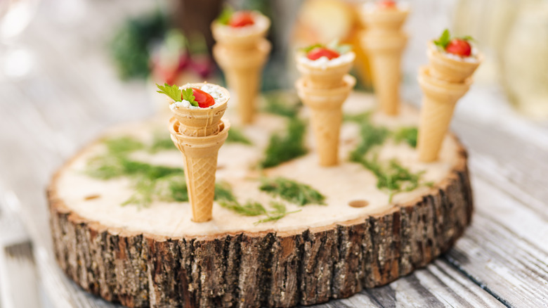 Miniature ice cream amuse bouche served on a tree bark