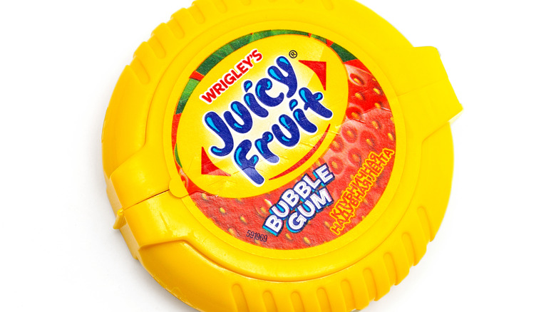 Round plastic package of Juicy Fruit gum.