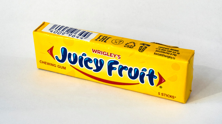 Closeup of Juicy Fruit gum package on white background.