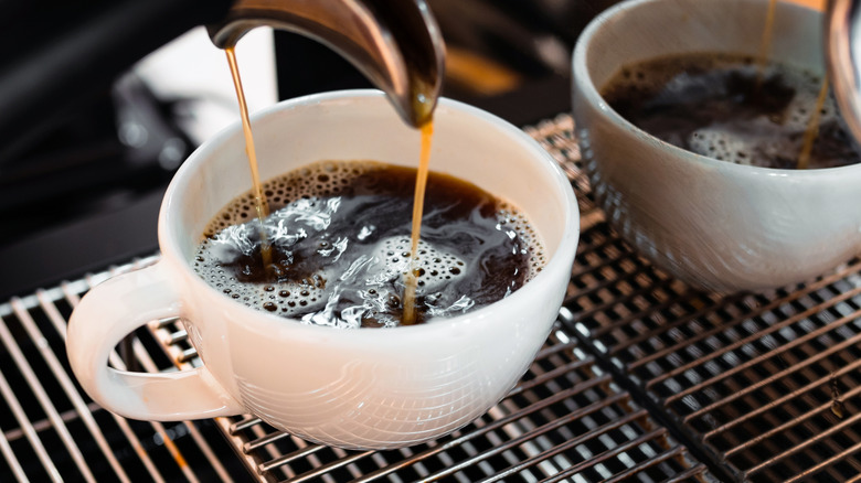 A cup of coffee being brewed.