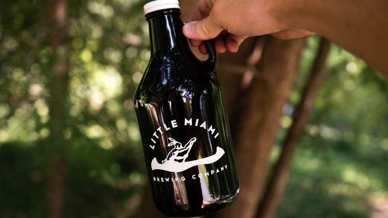 Person holding growler of beer from Little Miami Brewing Company