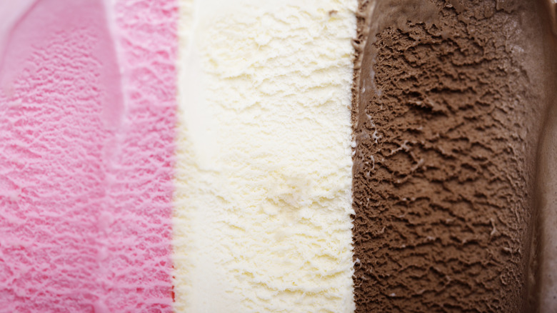 Closeup of Neapolitan ice cream is viewed from above.