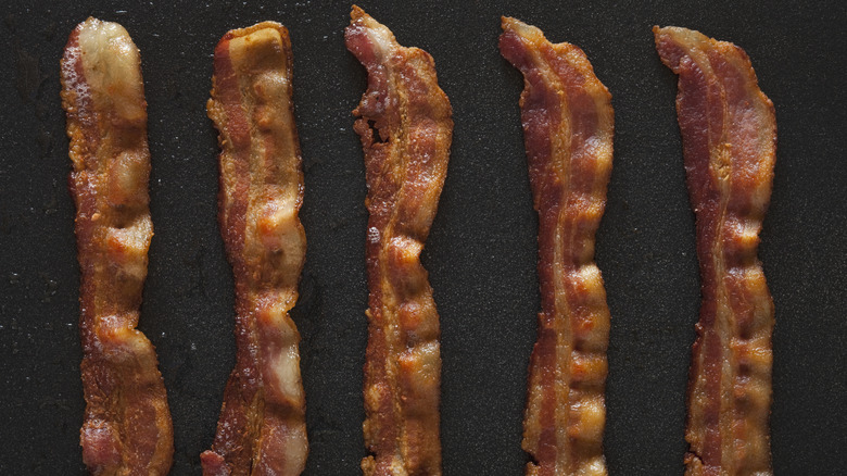 Strips of cooked bacon