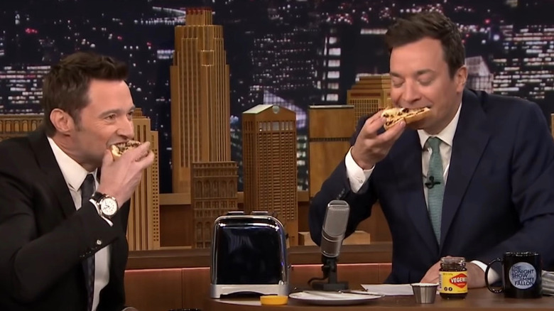 Hugh Jackman and Jimmy Fallon eating Vegemite on toast. 