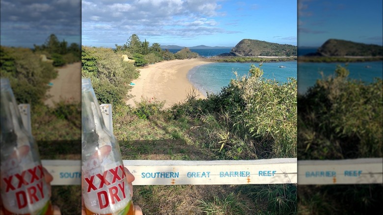 XXXX bottle with XXXX Island in the background