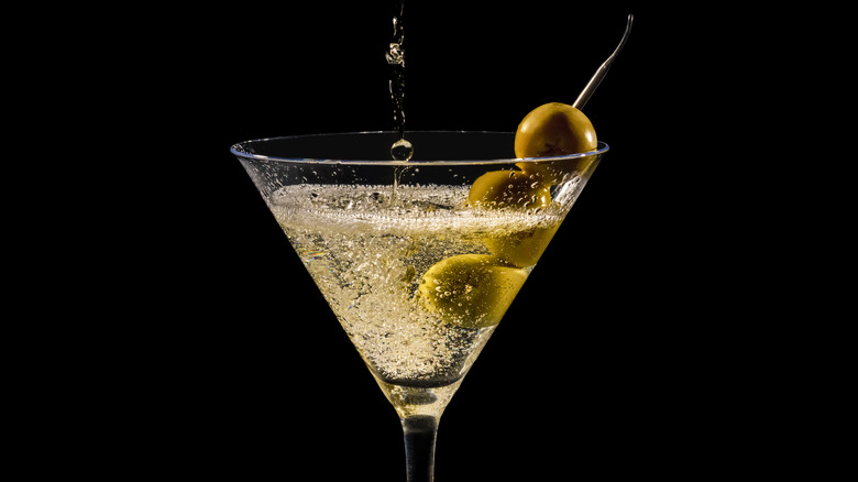 Dirty martini poured into glass