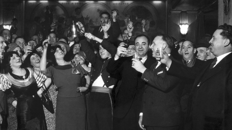 Well-dressed Chicago club patrons raise glasses to celebrate end of Prohibition in December 1933.