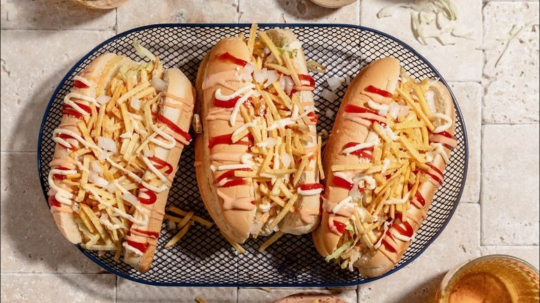 Three Venezuelan hot dogs on table