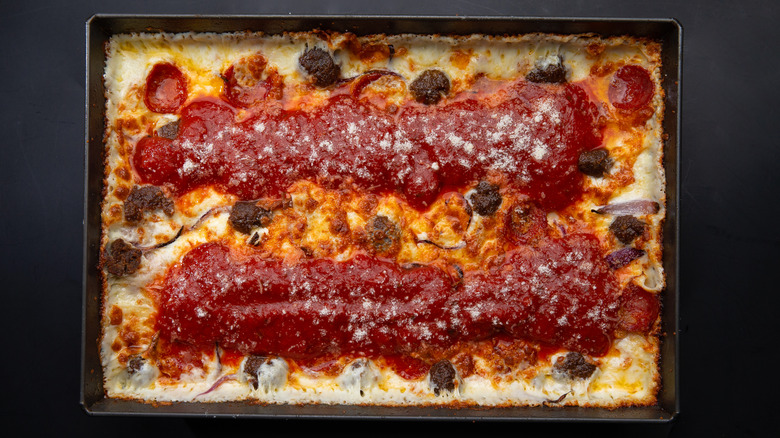 Detroit-style pizza in a steel pan