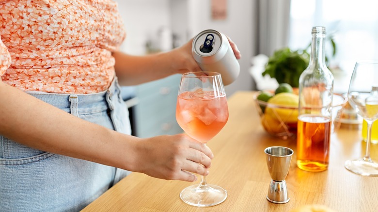 Woman mixing a wine cocktail
