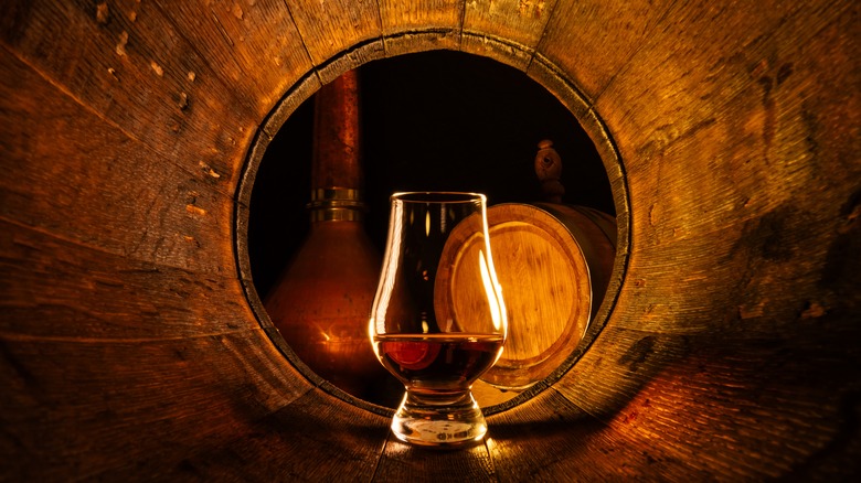 Whiskey glass inside a cask