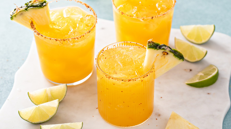 Pineapple margaritas with Tajín rims