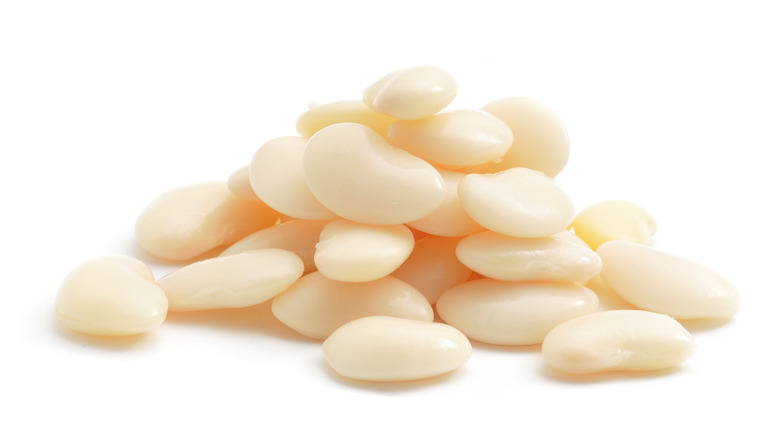 Close up of lima beans on a white background