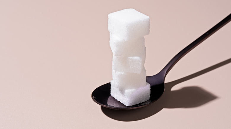 sugar cubes on spoon