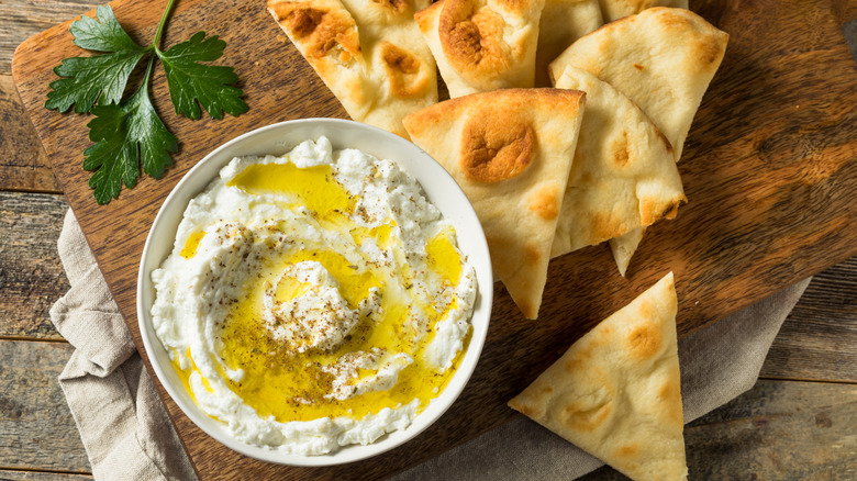 Labneh dip with olive oil drizzle in a bowl