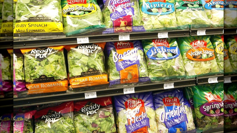 Bagged salad mixes on store shelf