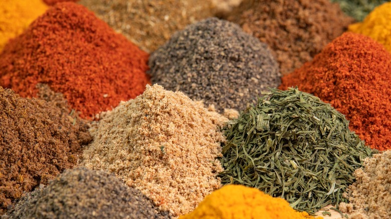 Various loose spices in piles